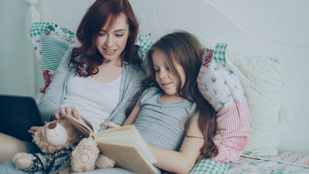 A mother and daughter reading a book together. Illustrative photograph, not an image of the specific event or discovery reported.