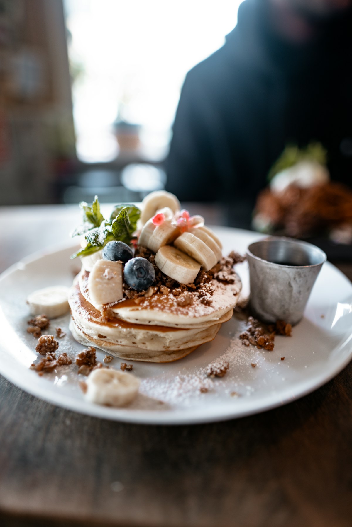 A stack of pancakes on a ceramic plate. Illustrative food photograph; the finished recipe may look different.