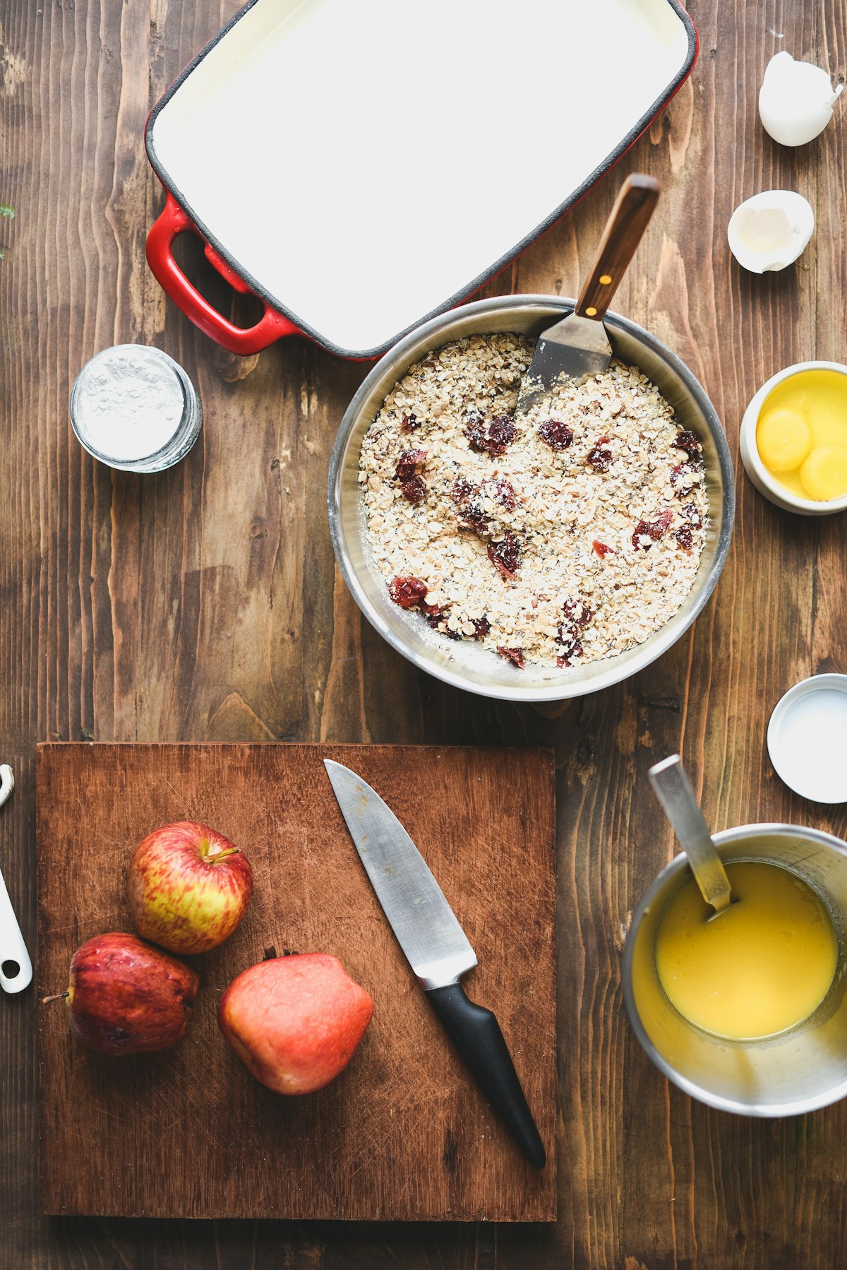 Apple slices and ingredients for a baked oat breakfast. Illustrative food photograph; the finished recipe may look different.